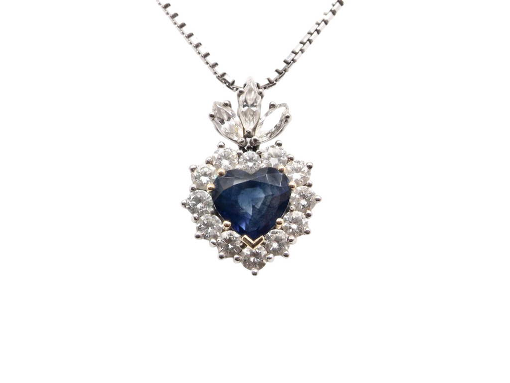 A heart shaped sapphire and diamond pendant
