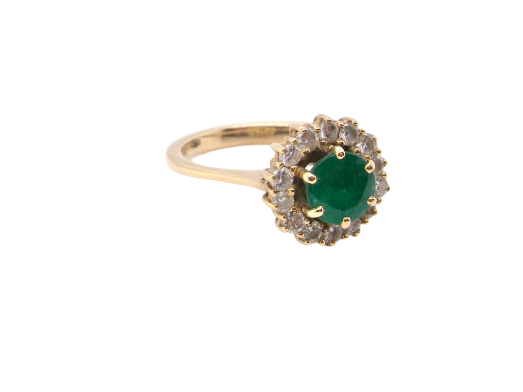 A traditional emerald and diamond  ring