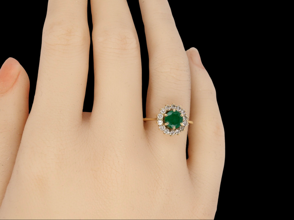Traditional emerald and diamond cluster ring