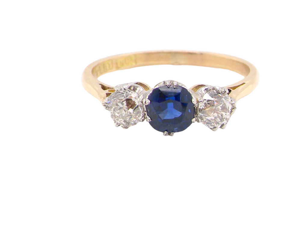 A classic three stone sapphire and diamond ring