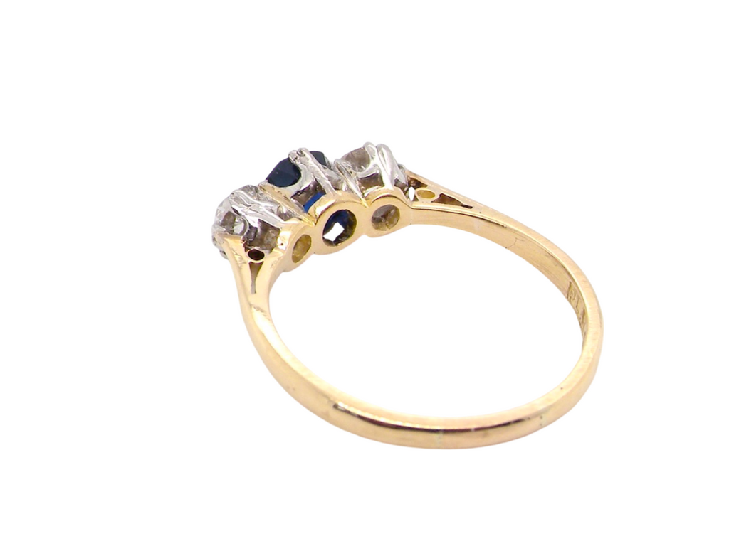 A classic three stone sapphire and diamond ring rear view