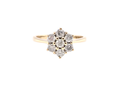 A traditional diamond cluster ring