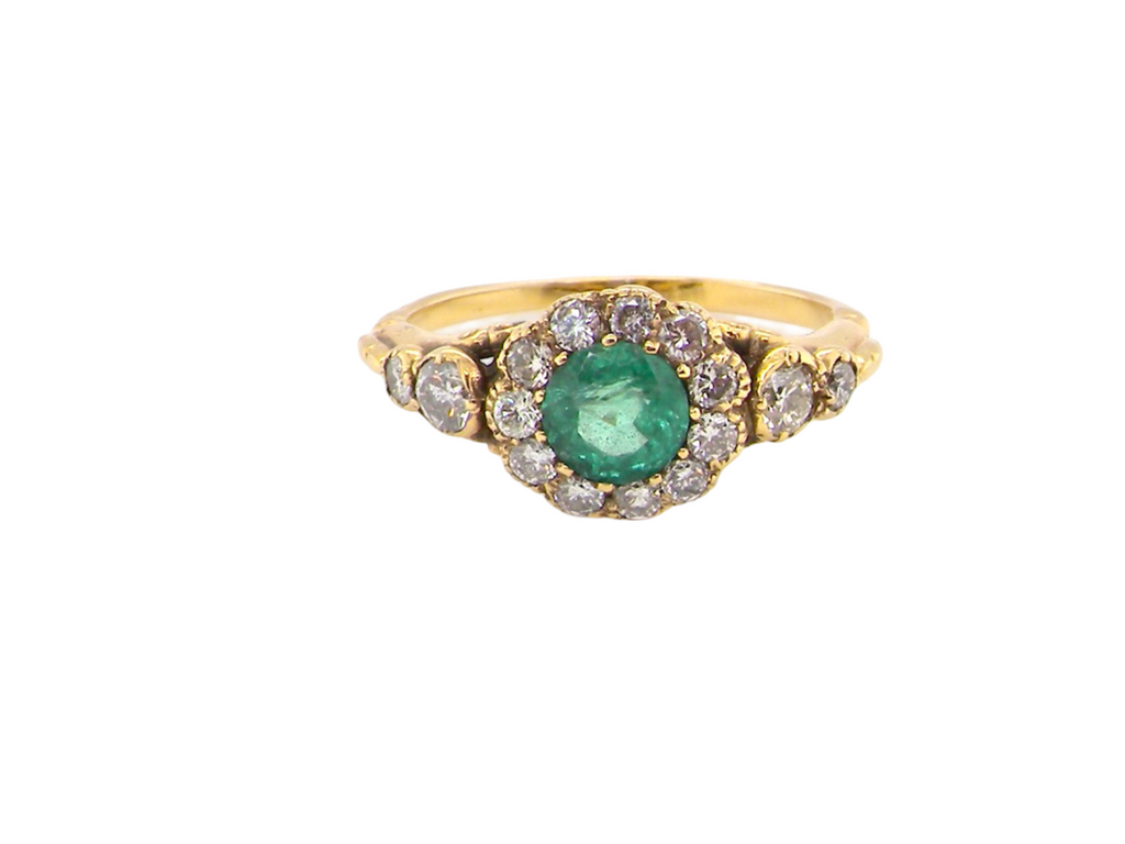 An antique Emerald and Diamond Cluster Ring