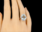 An impressive Aquamarine and Diamond Cluster Ring finger view