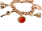 A gold charm bracelet with seals