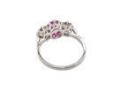 A platinum three stone pink sapphire and diamond ring rear view