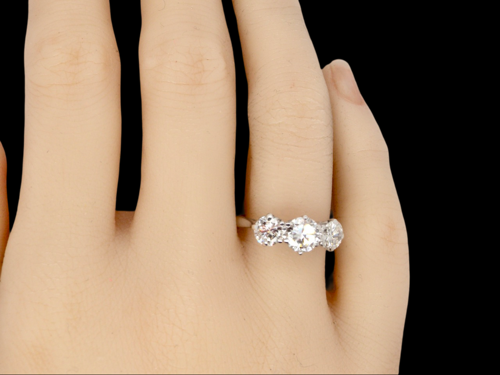 on finger view 3 stone diamond ring 1.7 carats