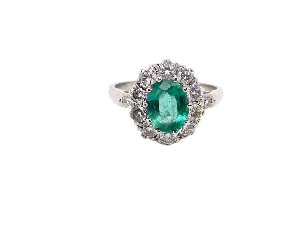 A gorgeous Emerald and Diamond Cluster Ring