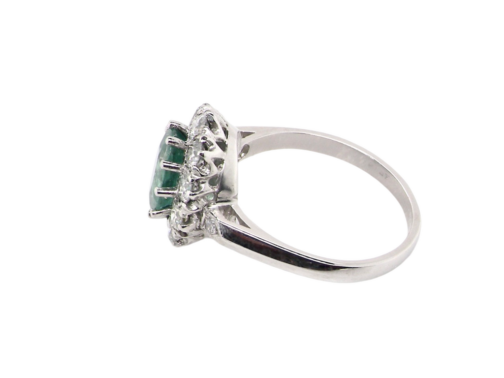 A gorgeous Emerald and Diamond Cluster Ring side view