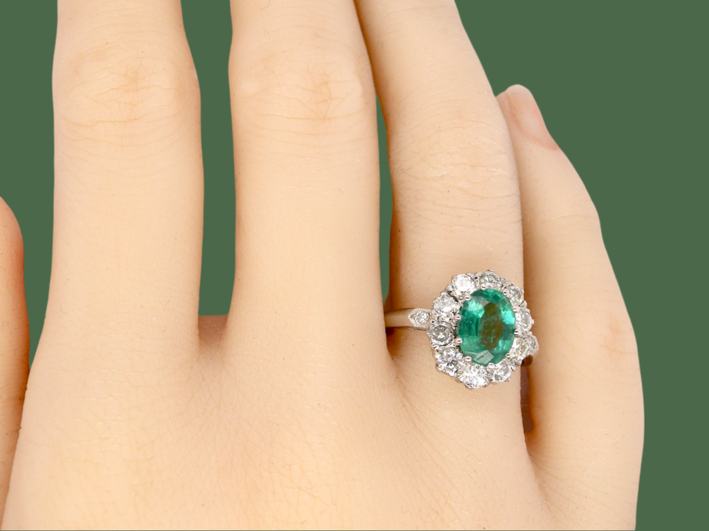 A gorgeous Emerald and Diamond Cluster Ring finger view