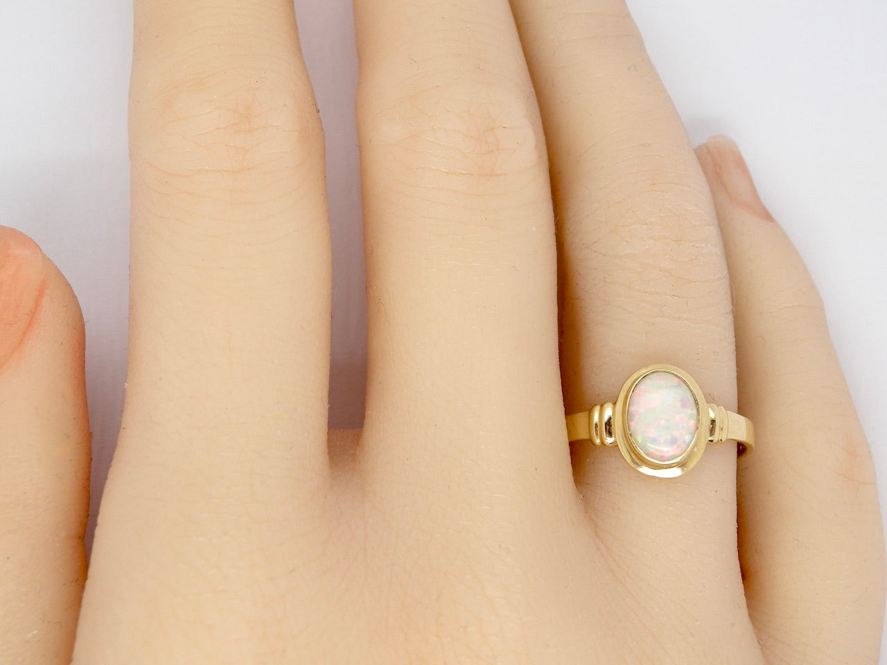 An Opal Dress Ring finger view