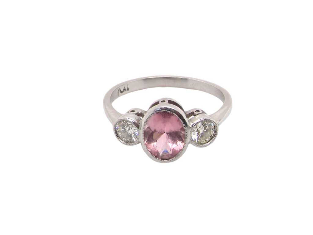 A 3 stone Pink Sapphire and Diamond RingA three stone Pink Sapphire and Diamond Ring