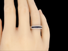 A white gold sapphire and diamond eternity ring finger view