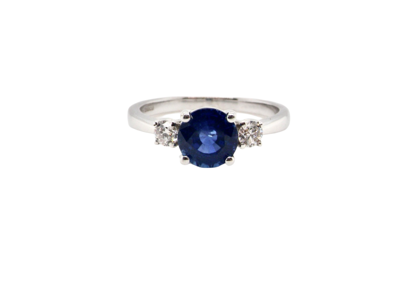 A fine three stone Sapphire and Diamond Ring