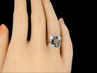 An aquamarine dress ring finger view