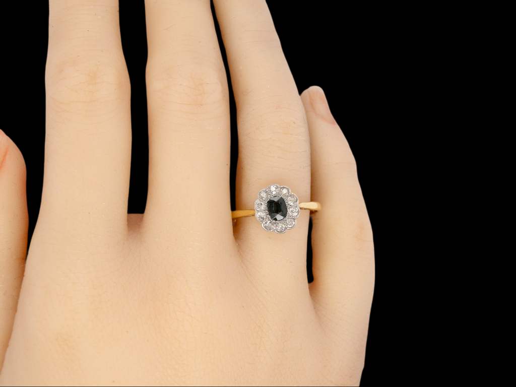 A vintage Sapphire and Diamond cluster ring finger view