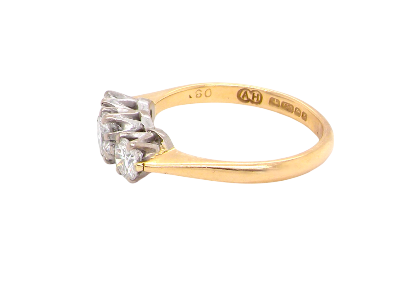 A traditional three stone Diamond Ring side view