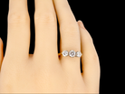 A traditional three stone Diamond Ring finger view