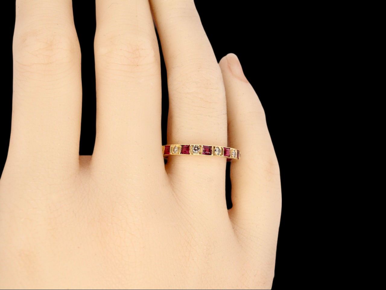 A Ruby and Diamond full eternity ring finger view