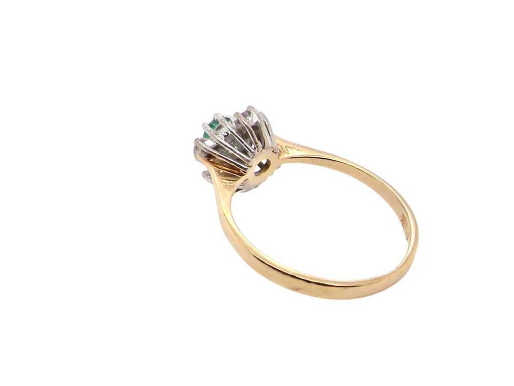 An Emerald and Diamond Cluster Ring rear view