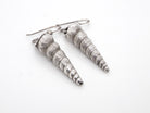 A pair of silver drop earrings