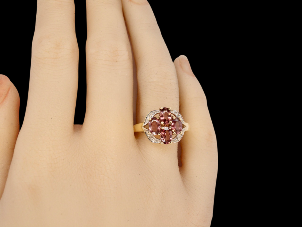 A Garnet and Diamond Ring finger view