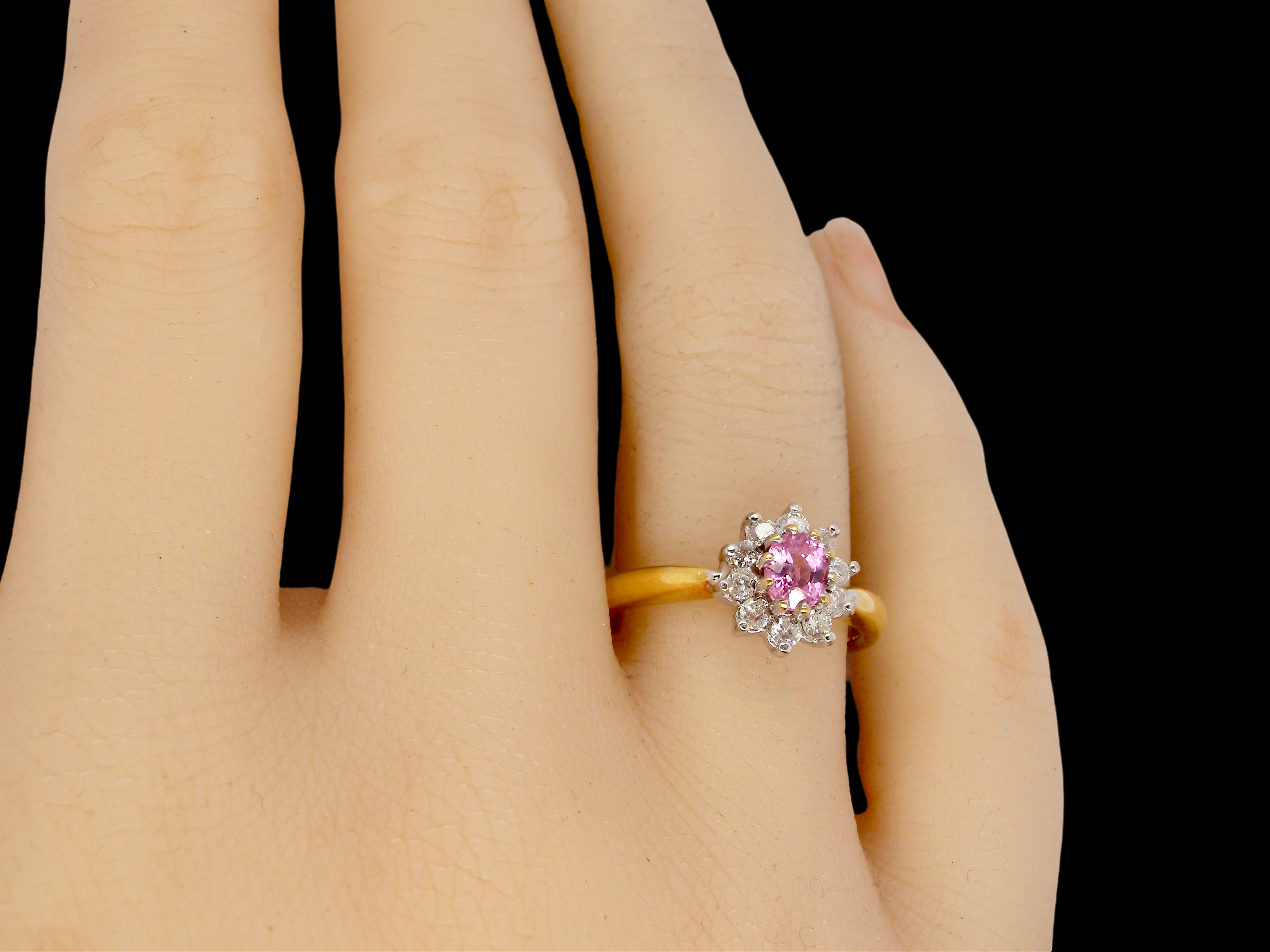 A Pink Sapphire and Diamond Ring finger view