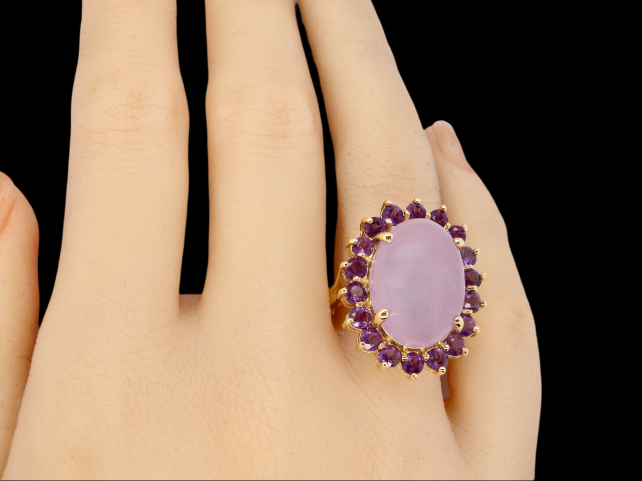 A large Jade and Amethyst dress ring finger view