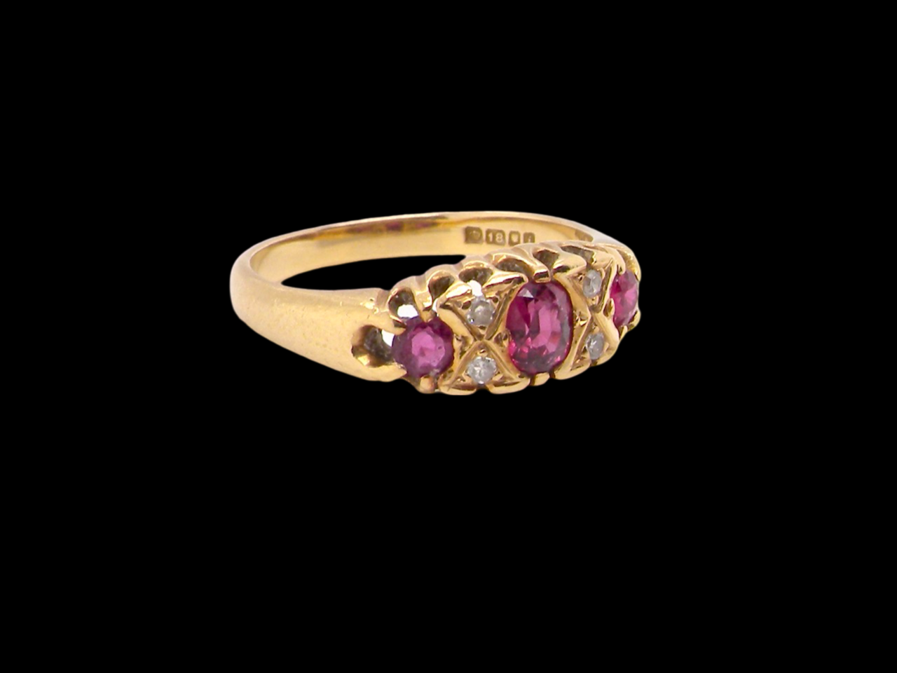 A vintage style ruby and diamond ring side view