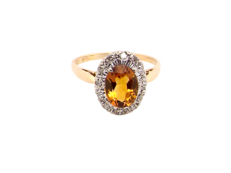 A yellow Topaz and Diamond cluster ring