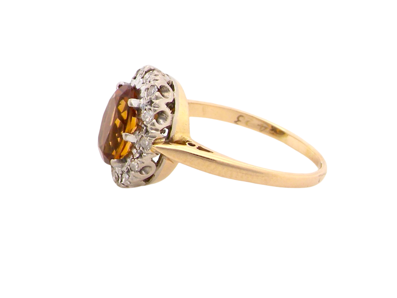 A yellow Topaz and Diamond cluster ring side view