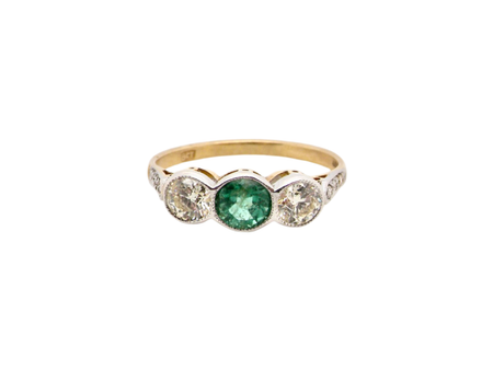 An Emerald and Diamond three stone ring