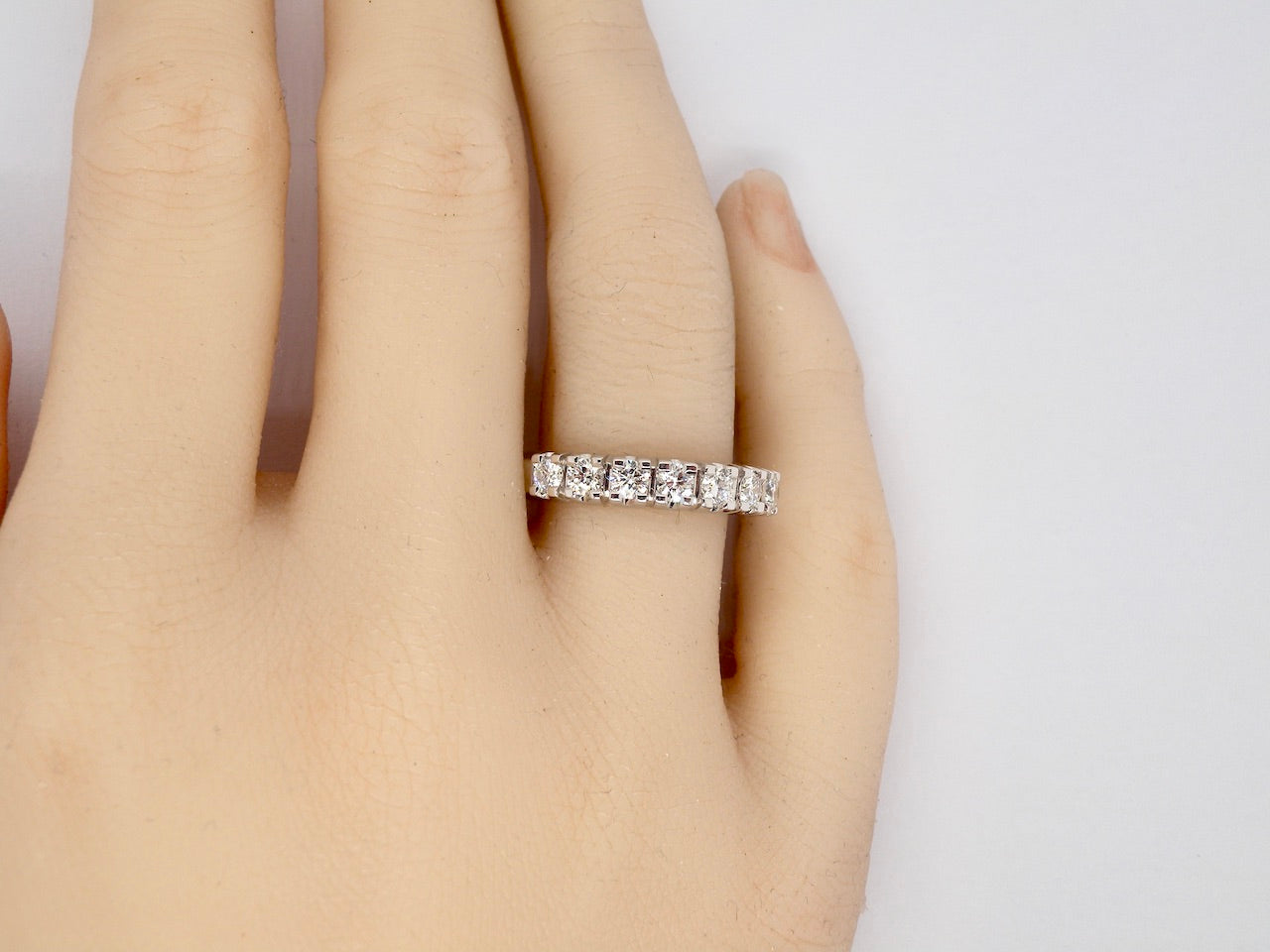 A white gold Diamond Eternity Ring finger view