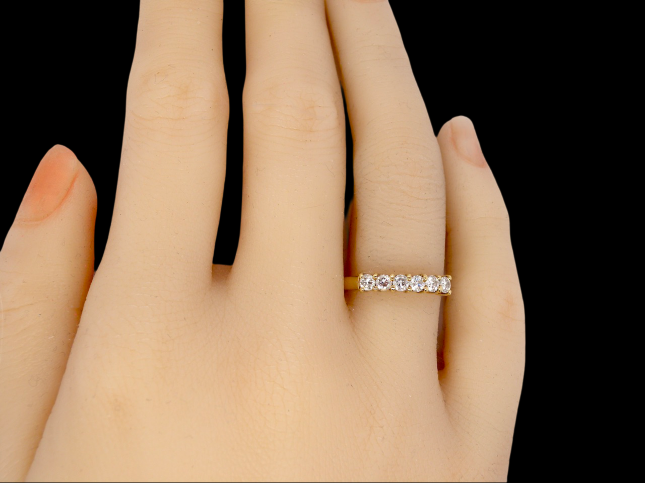 A half hoop diamond ring finger view