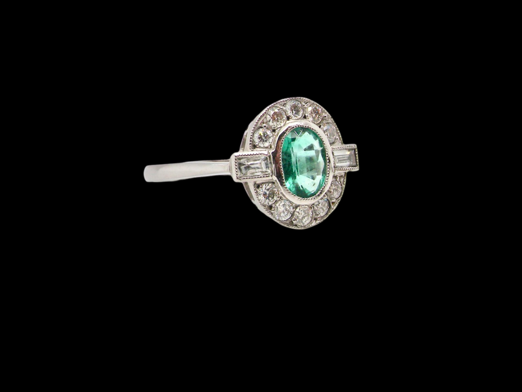 An Emerald and Diamond Ring