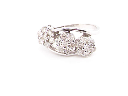 An 18ct white gold triple diamond cluster ring