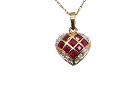 A ruby and diamond heart shaped pendant