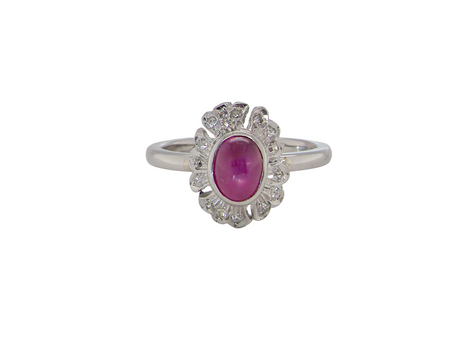 A cabouchon cut ruby and diamond ring