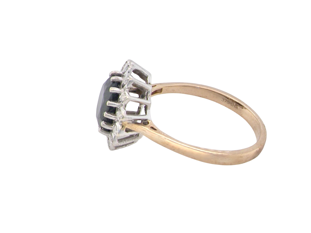 side A timeless cluster ring featuring a deep ink-black blue sapphire 