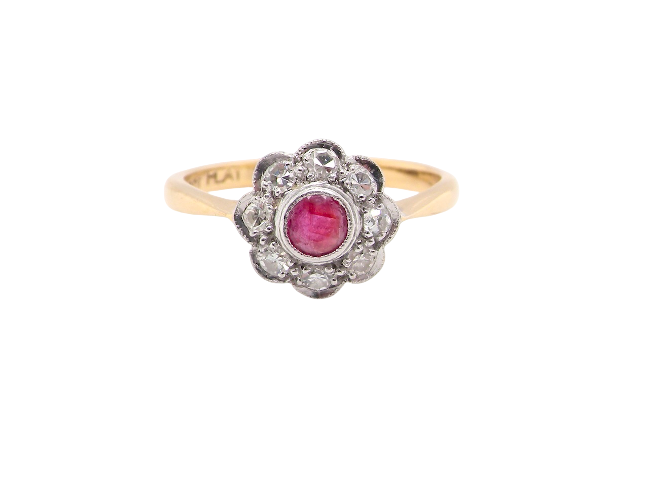 Gold ring with a red gemstone and diamond accents on a white background
