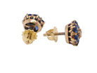 Gold earrings with blue gemstones on a white background