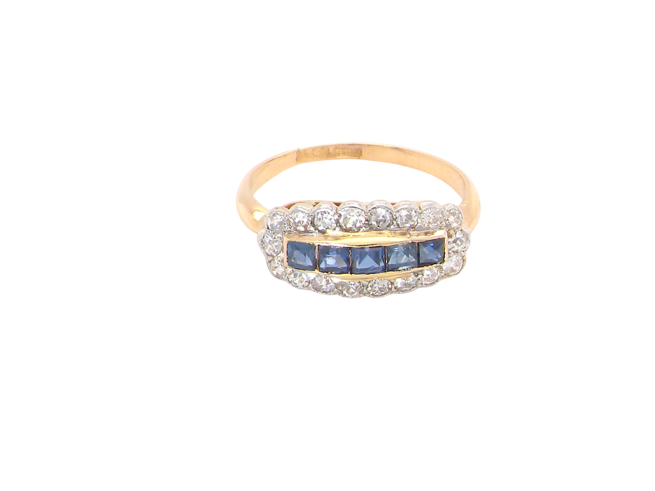 Gold ring with blue gemstones and diamonds on a white background