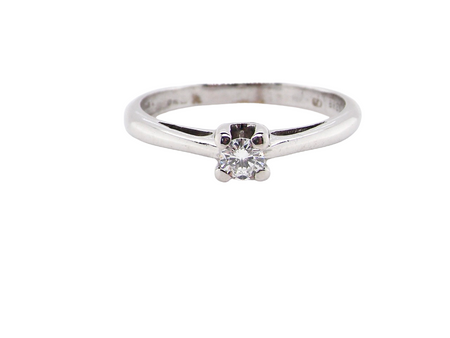 A white gold diamond solitaire ring