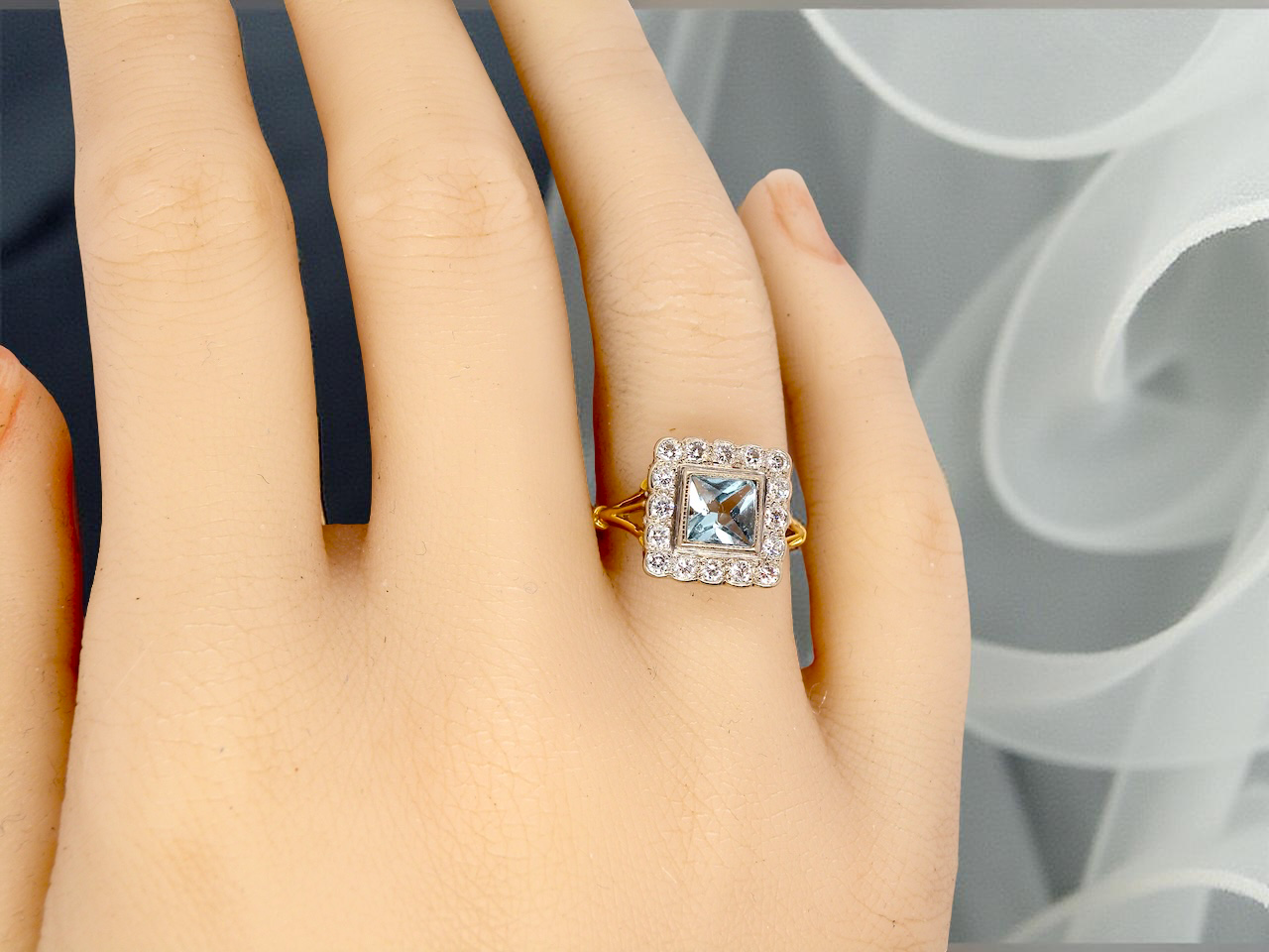 A vintage Aquamarine and Diamond cluster ring
