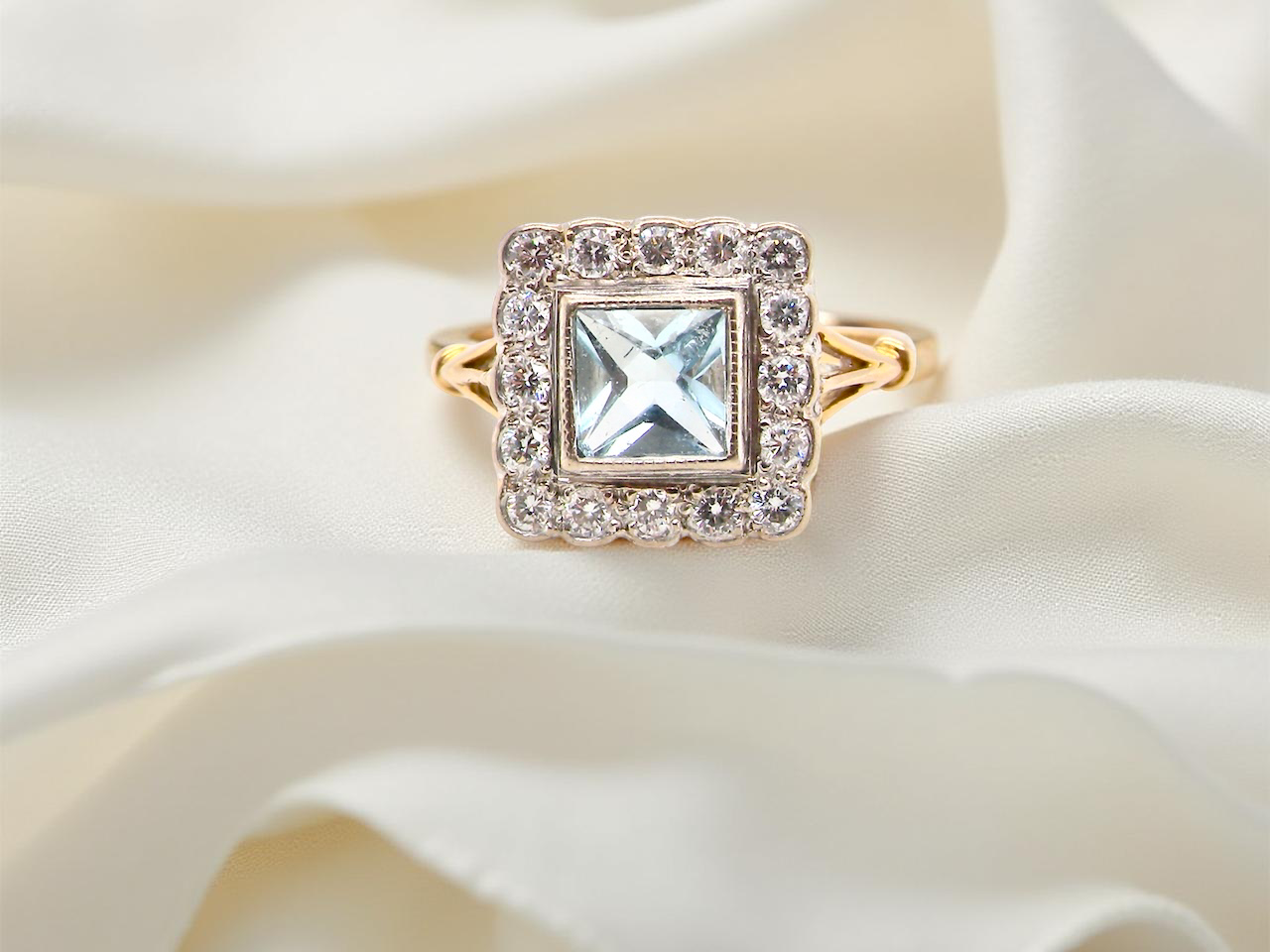 A vintage Aquamarine and Diamond cluster ring