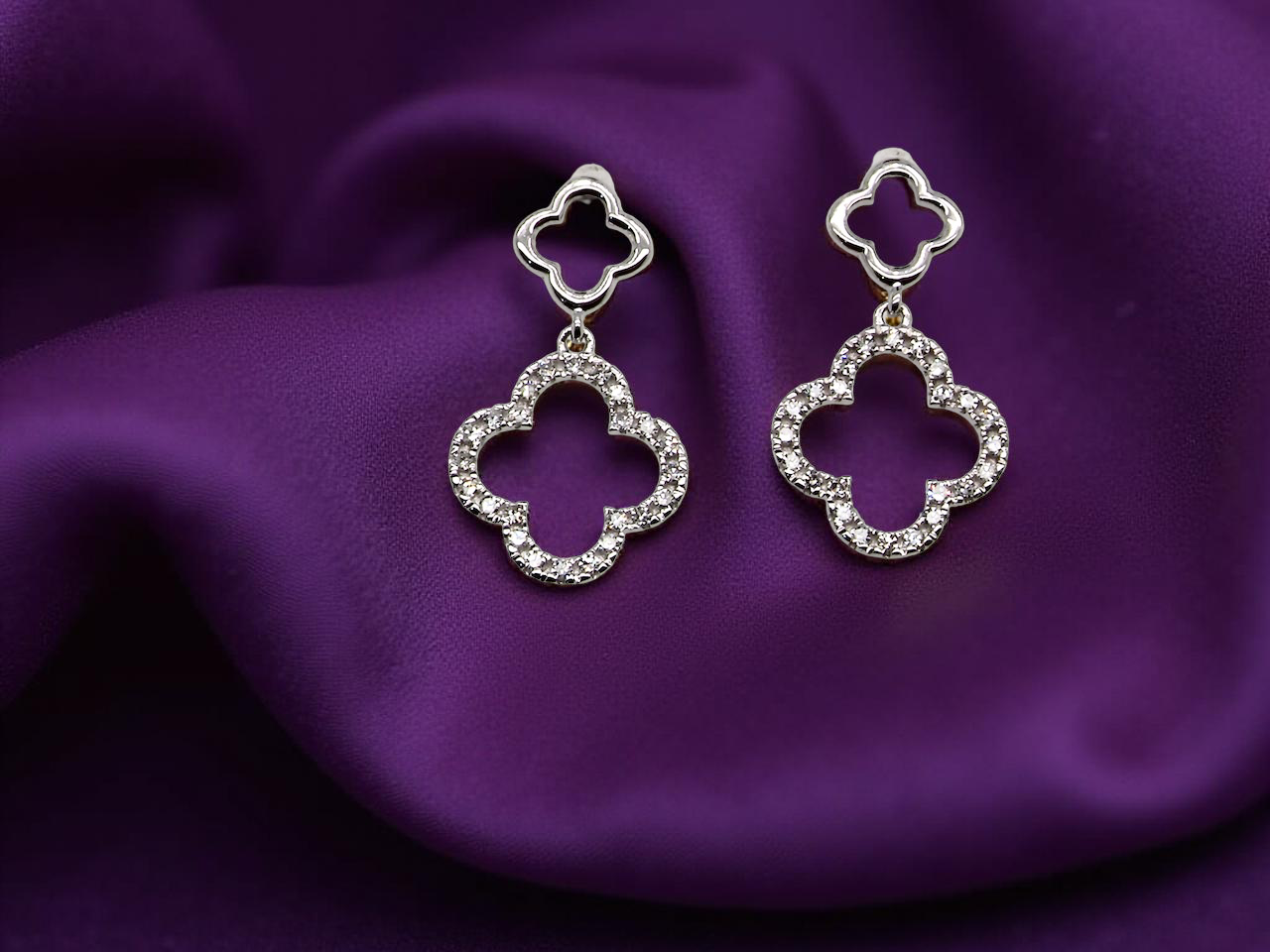 Each earring is set with brilliant cut white diamonds, to a total of 0.51 carats.&nbsp; new