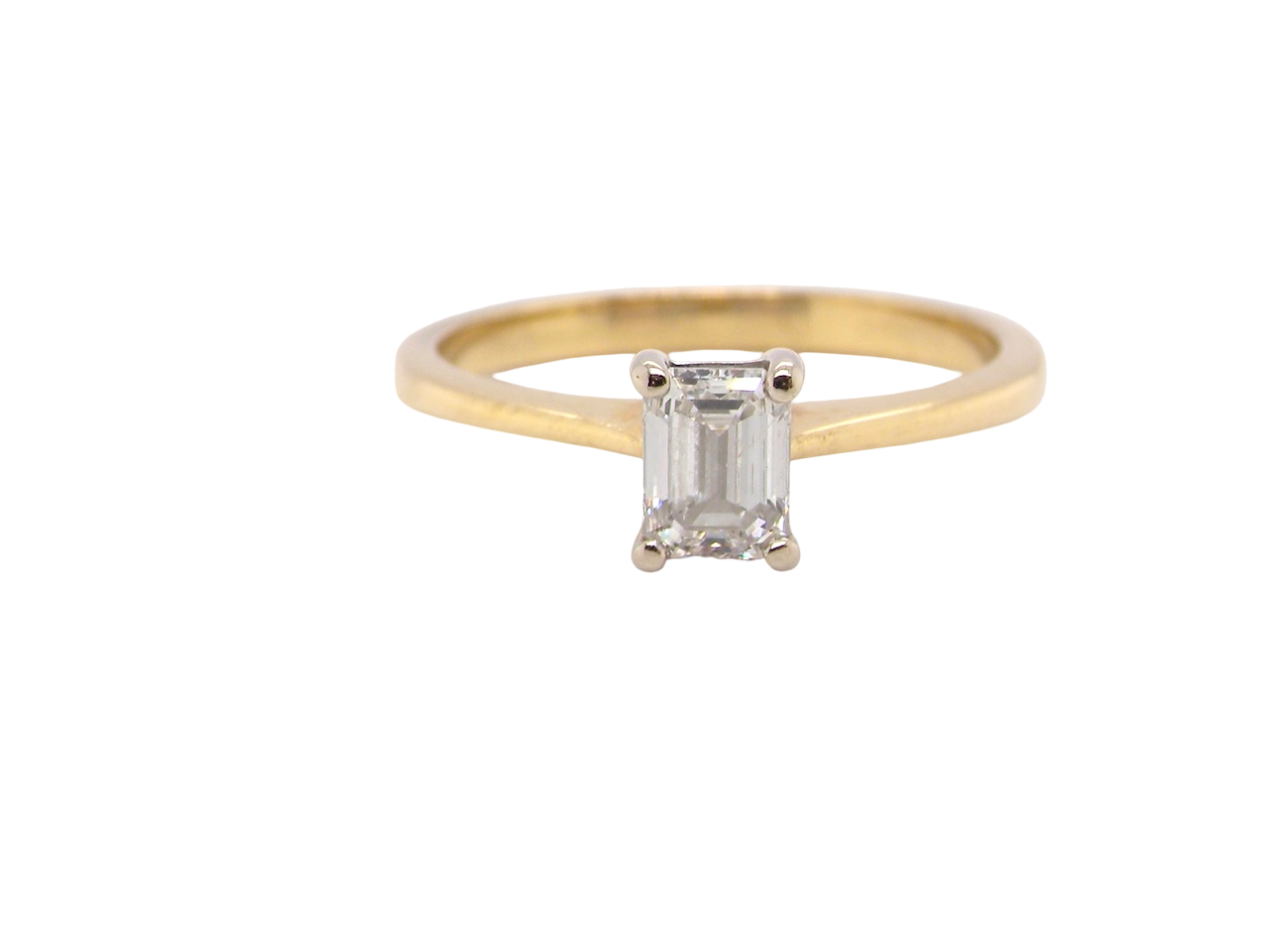 Elegant and timeless, this solitaire ring features a beautifully cut emerald-cut diamond measuring 5 x 4mm, confirmed at approximately 0.40 carats. The diamond is graded J colour and VS clarity, offering excellent sparkle 