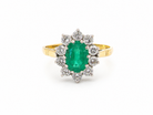 Features an oval cut emerald centre stone, vibrant green hues, measures 9x6mm(est 1.75 carats) . Complimented by an outer halo of ten 2.7mm brilliant cut white diamonds (est total 0.60 carats) colour i-j, clarity S.

