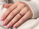 HAND A vintage 18 carat gold three stone ring. Set with brilliant cut white diamonds, cente 3mm, each side a 2.4mm diamond (total est 0.20 carats) Colour I-j, clarity Si.&nbsp;
