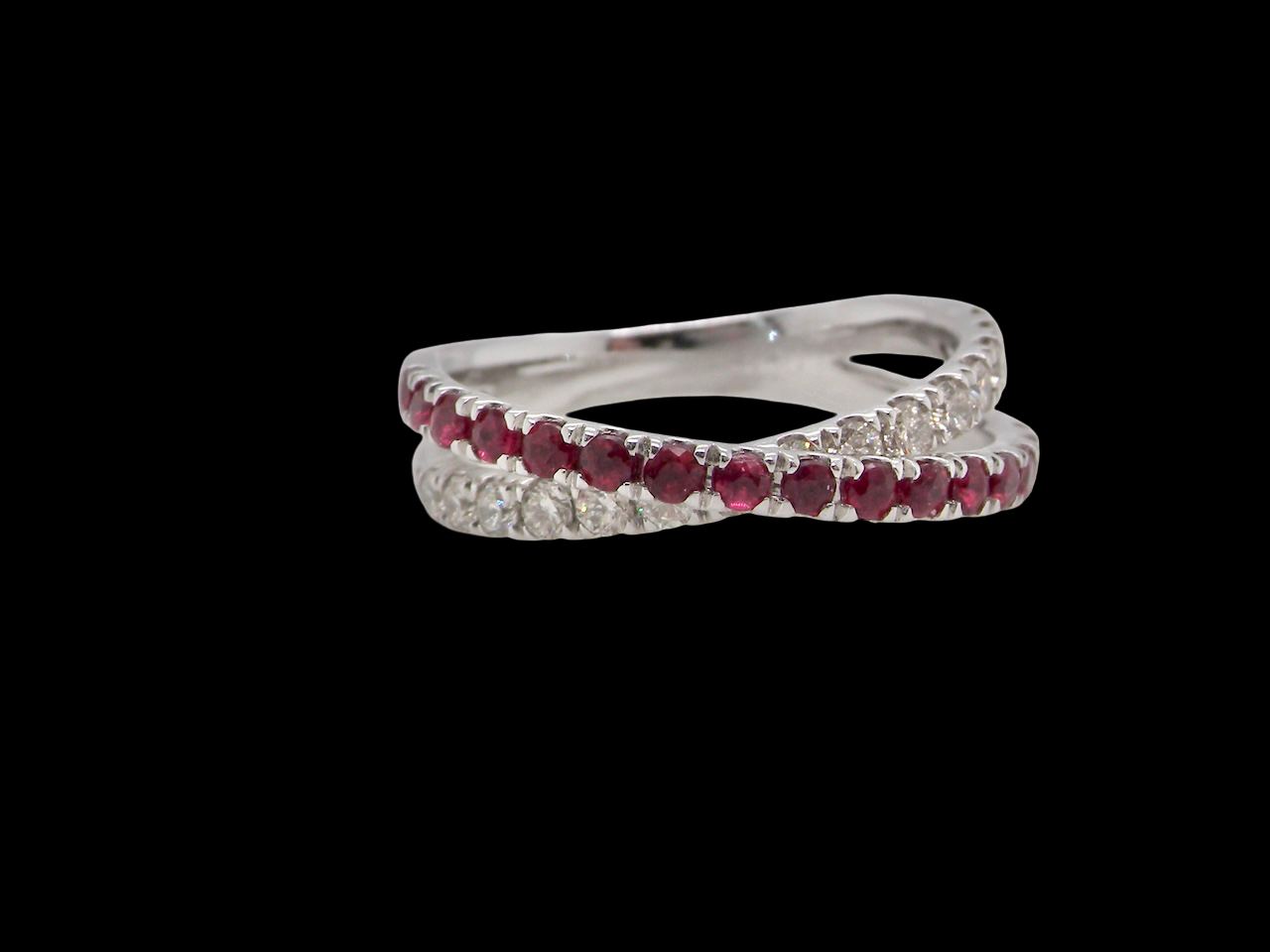 A NEW ruby and diamond cross over ring